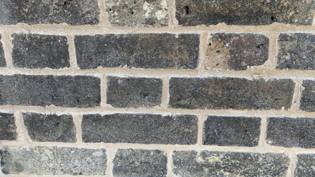 Close up of lime pointing on an oast house in Rochester, a flush finish